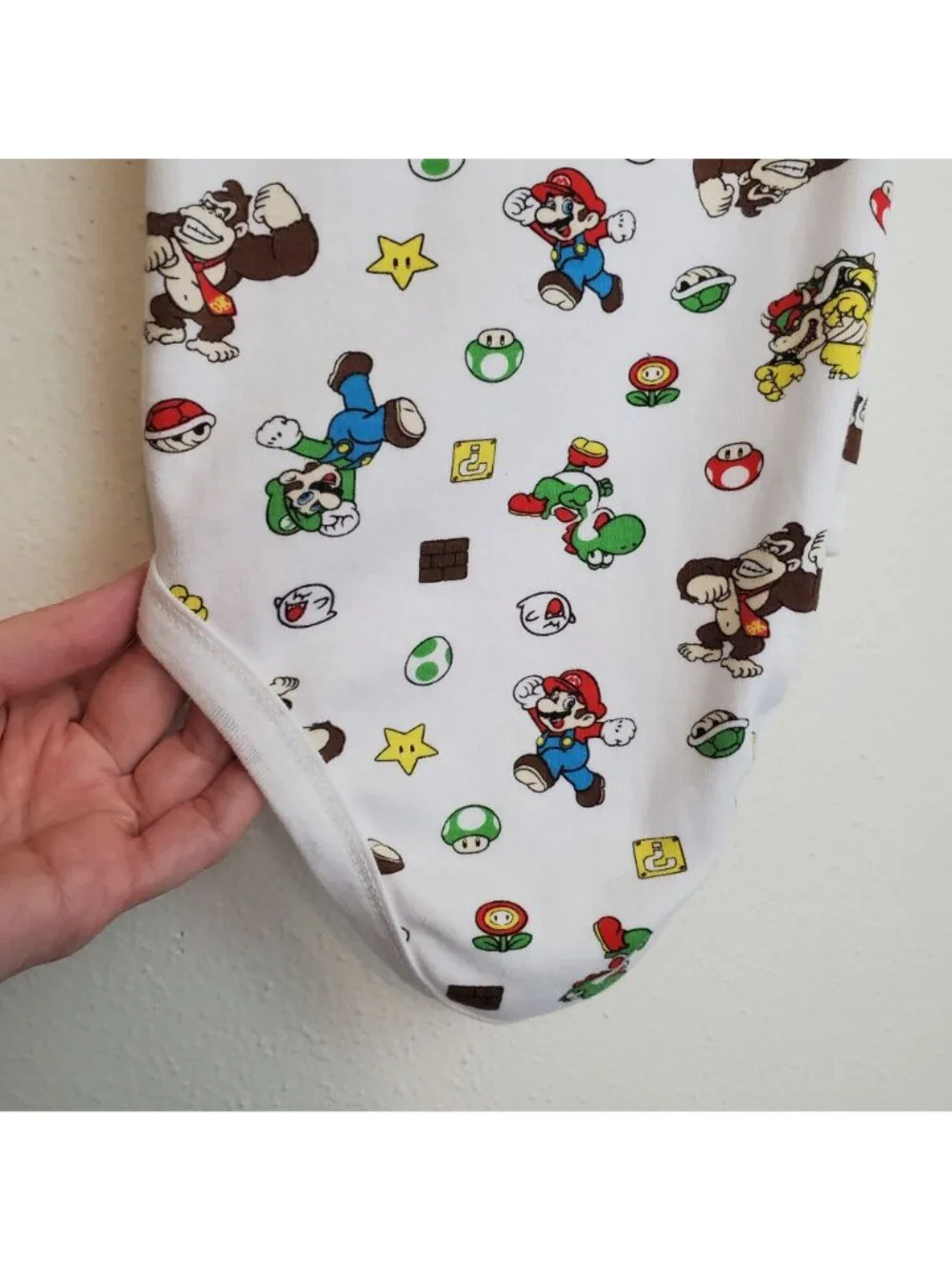 Super Mario Nintendo all-over-print baby onesie